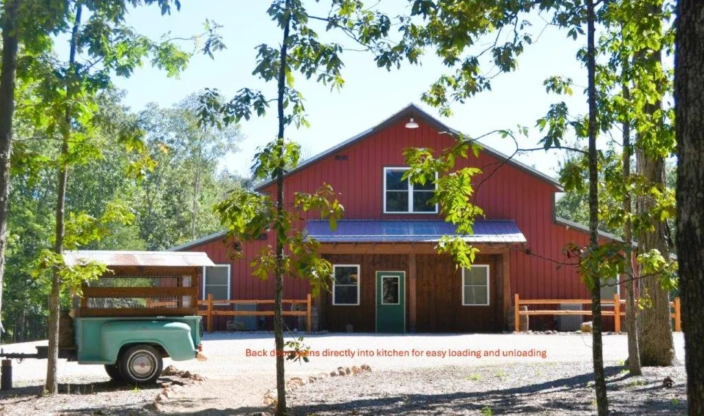 Back of lodge with vintage teal truck