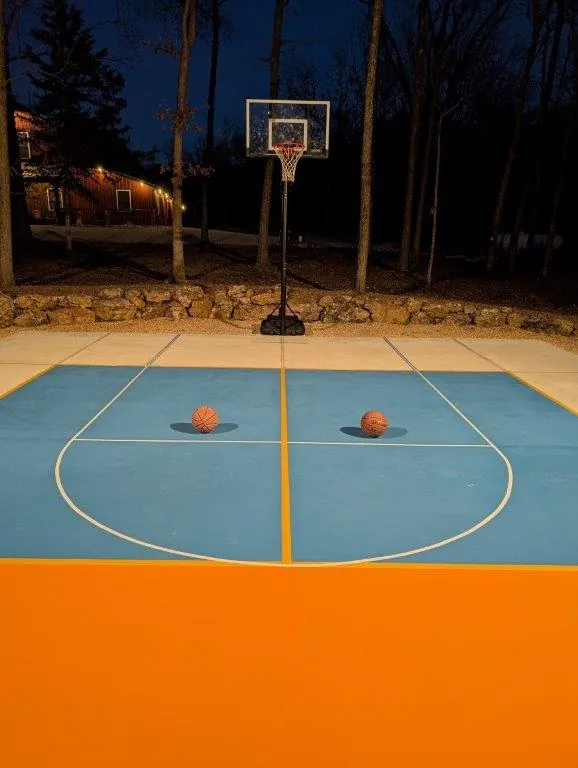 Basketball end of court at night