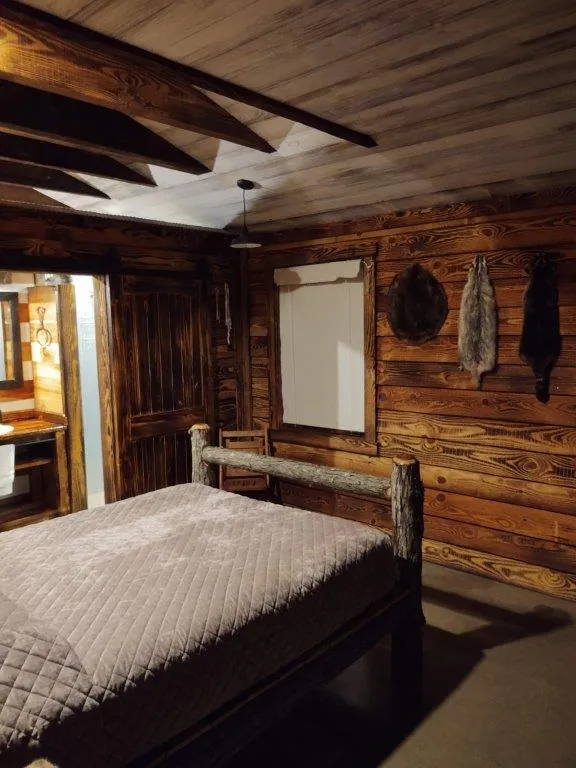Trapper Cabin bed and fur pelts